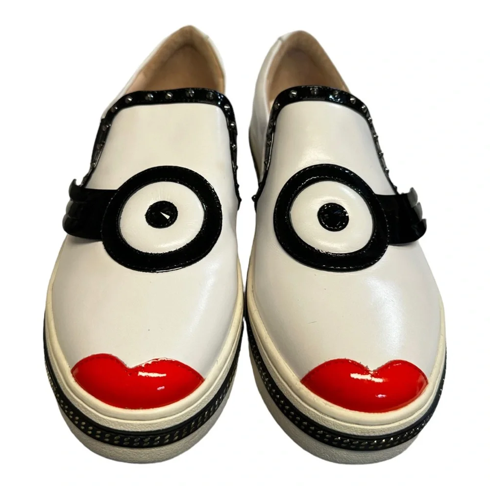 White Leather Slip-On Sneakers with Black Trim and Red Accent
